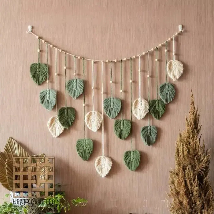 Tapisserie murale bohème 120x75cm, panneau en macramé avec feuilles et pompons, feuille verte, décor