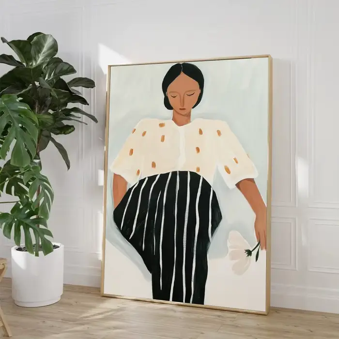 Peinture sur toile représentant une femme lisant sur la plage